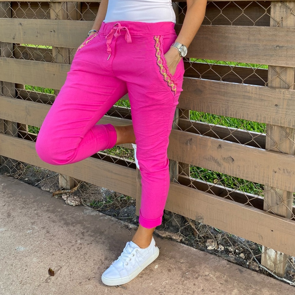 Hot pink joggers with crochet detail